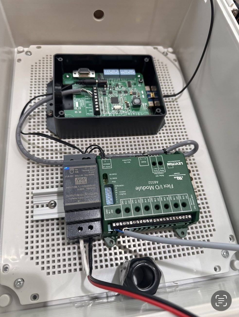 Work in progress: enclosure with DIN-rail power supply, Leviton Flex I/O module and wired communication assembly